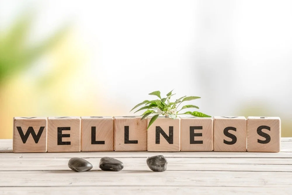 "A variety of wellness products, including essential oils, vitamins, herbal teas, skincare items, and aromatherapy diffusers, arranged neatly on a wooden shelf, promoting health and relaxation."