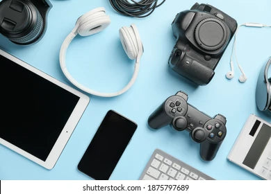 A sleek array of the latest electronics, featuring a smartphone, laptop, tablet, wireless earbuds, smartwatch, and smart home devices on a stylish surface."  This brief description captures the essence of the collection while highlighting key items.