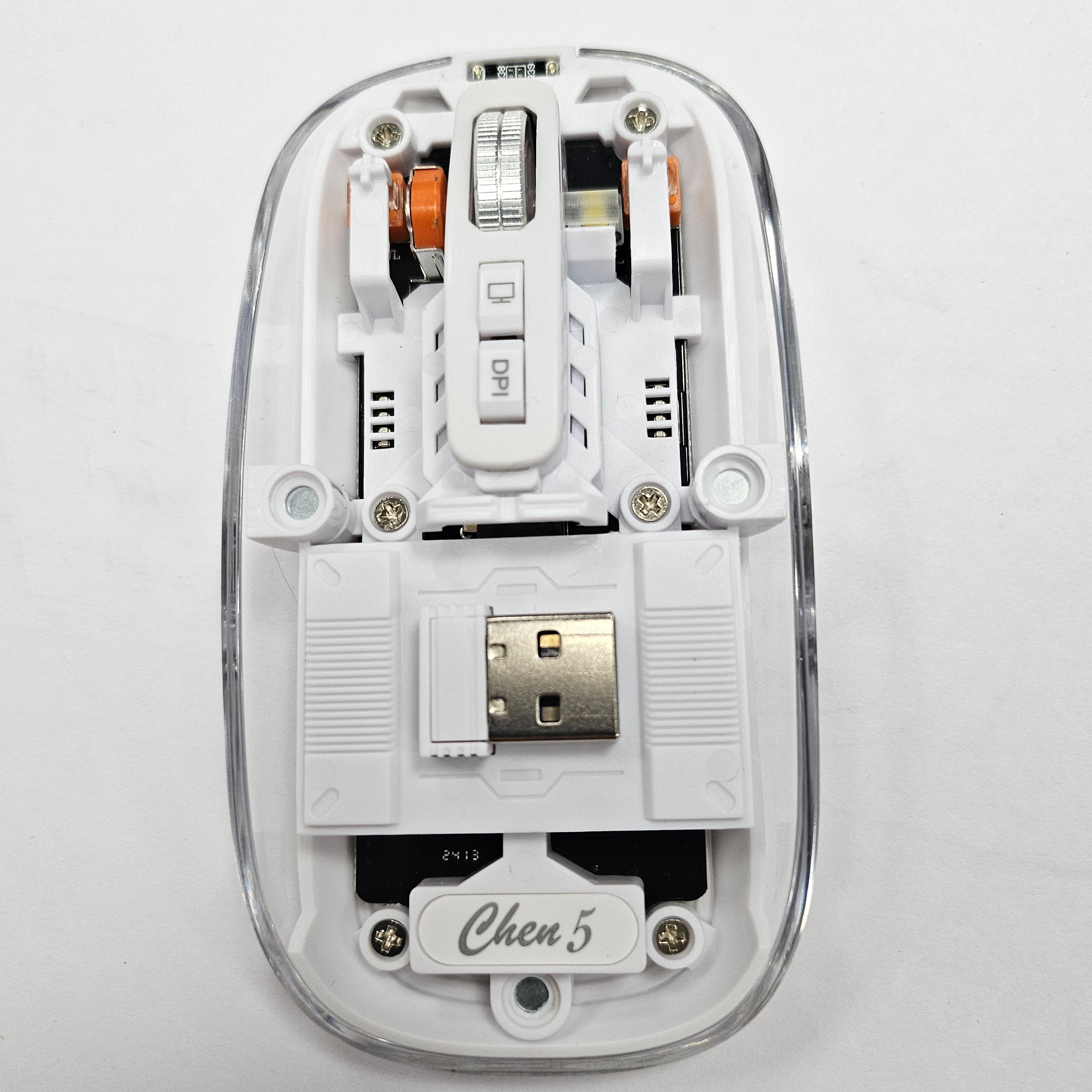 Clear, transparent computer mouse with sleek, minimalist design and ergonomic shape, ideal for modern workspaces.