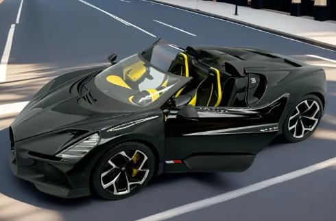 1:18 scale Bugatti Mistral W16 diecast sports car model in black and yellow with alloy body, detailed exterior, and wind-powered push.